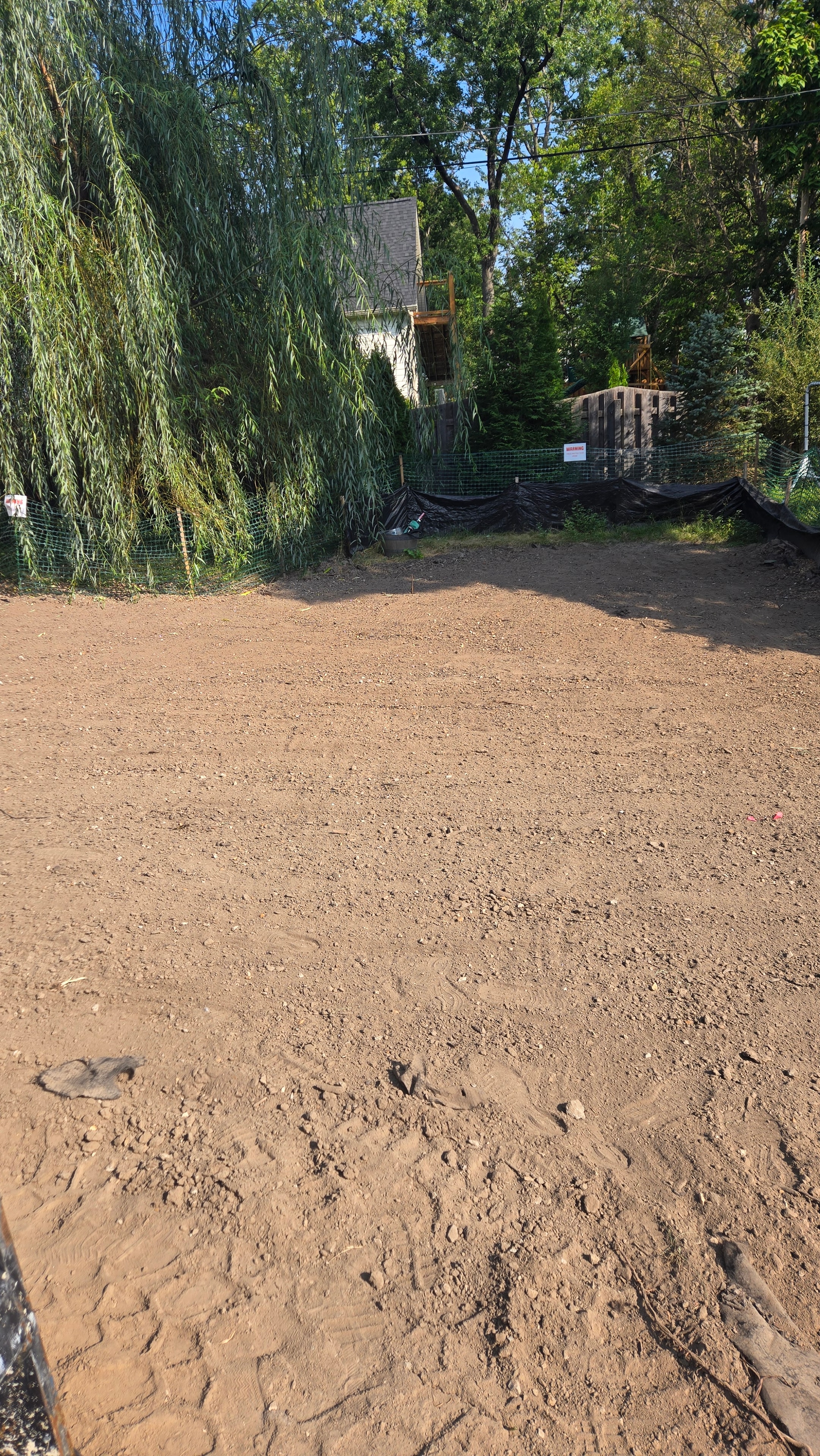 Second angle of backyard site preparation before hydroseeding