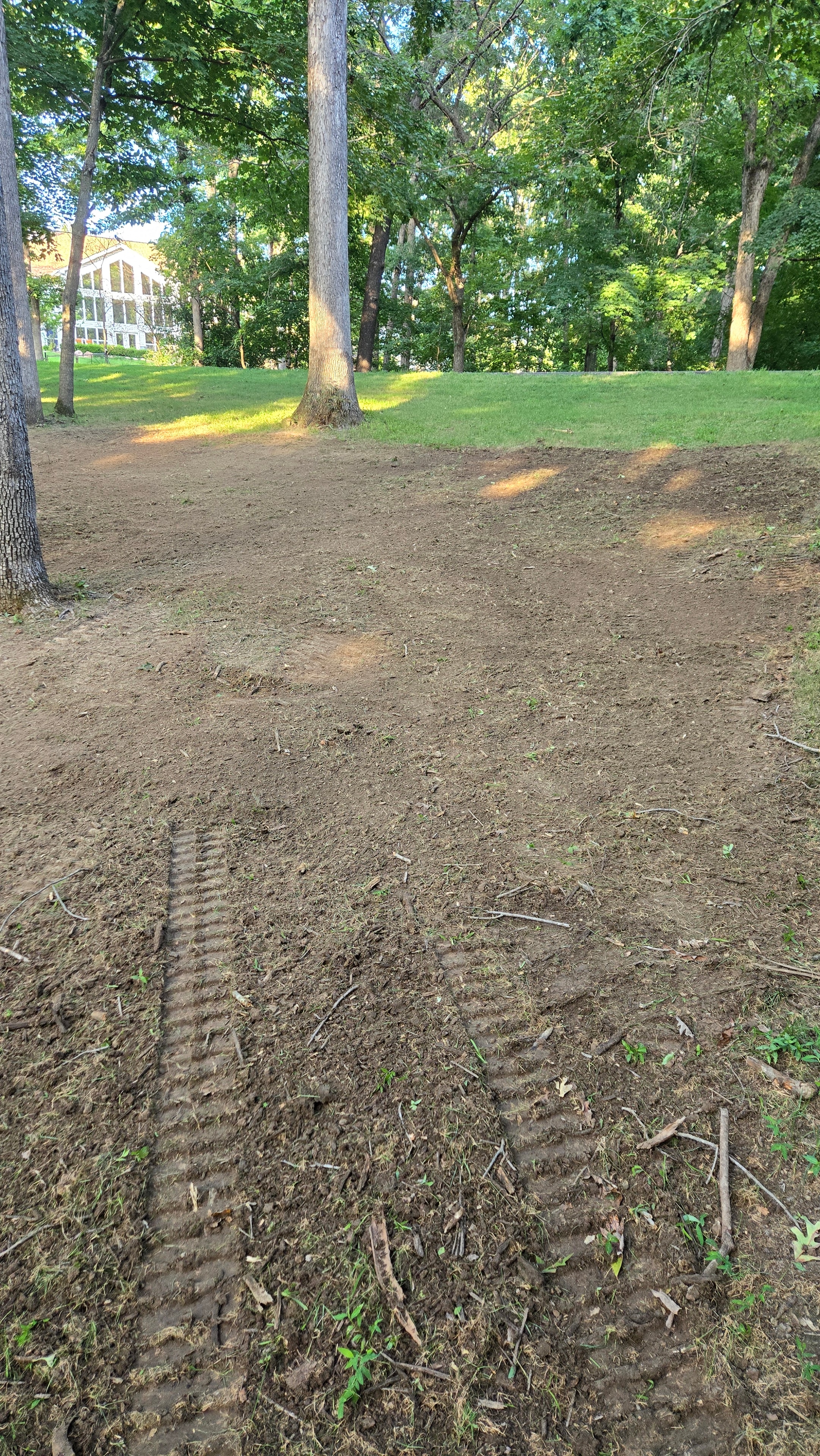 Graded dirt yard prepared for hydroseeding application